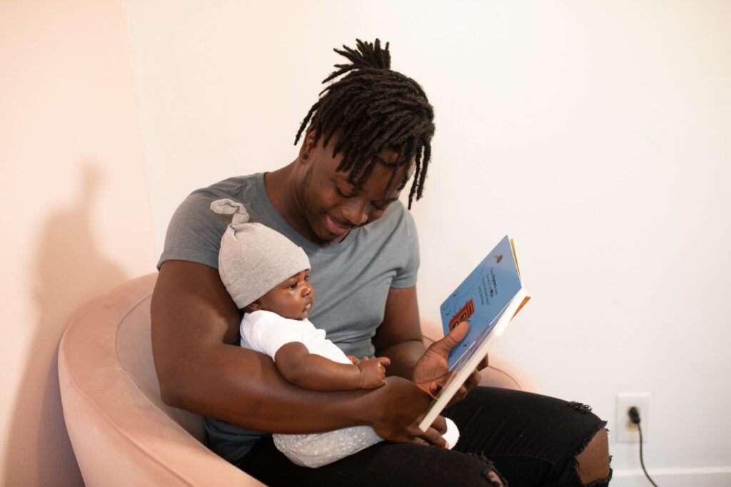 Father reading to baby during bedtime routine 